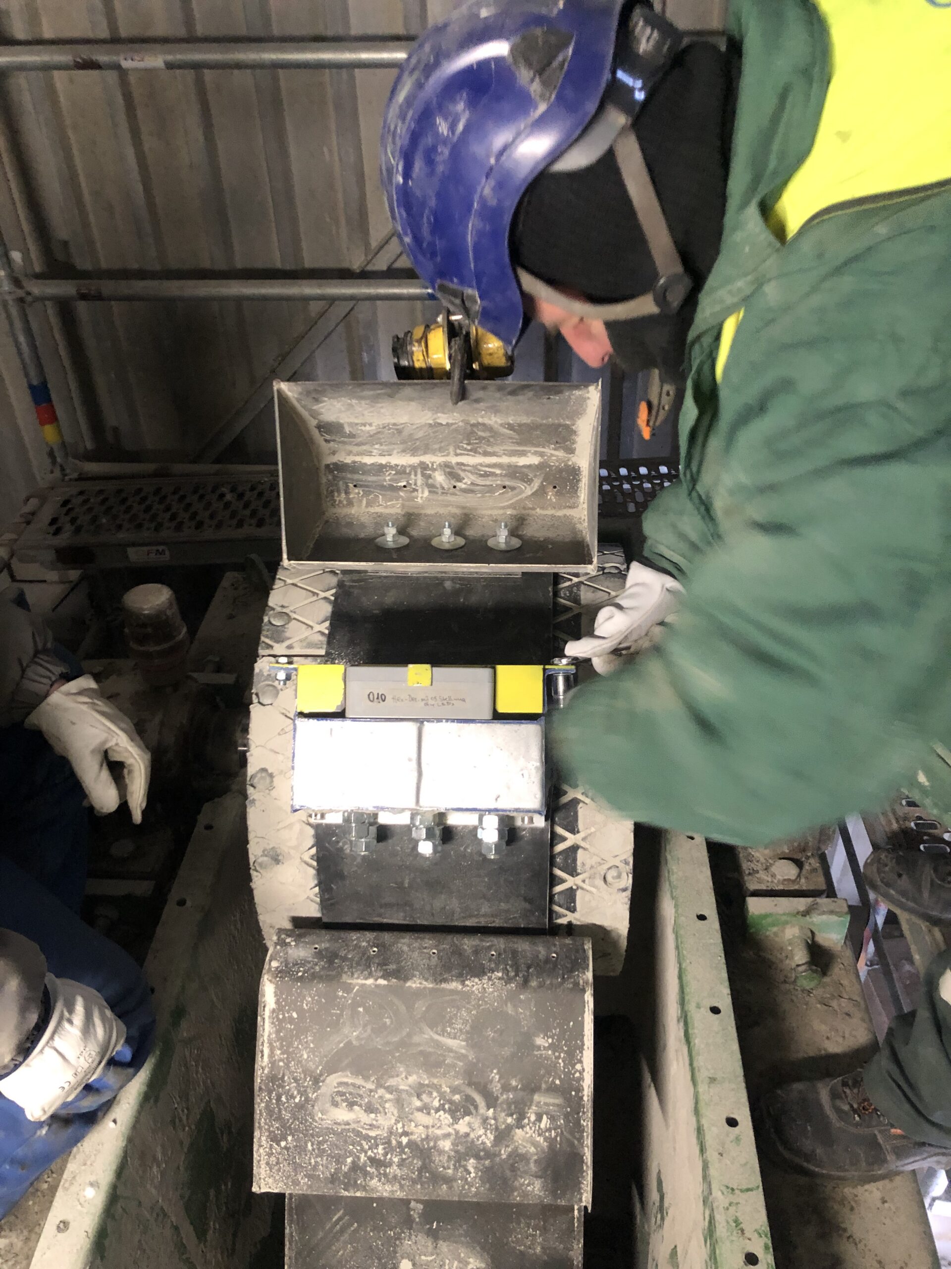 Technician inspecting a bucket elevator belt
